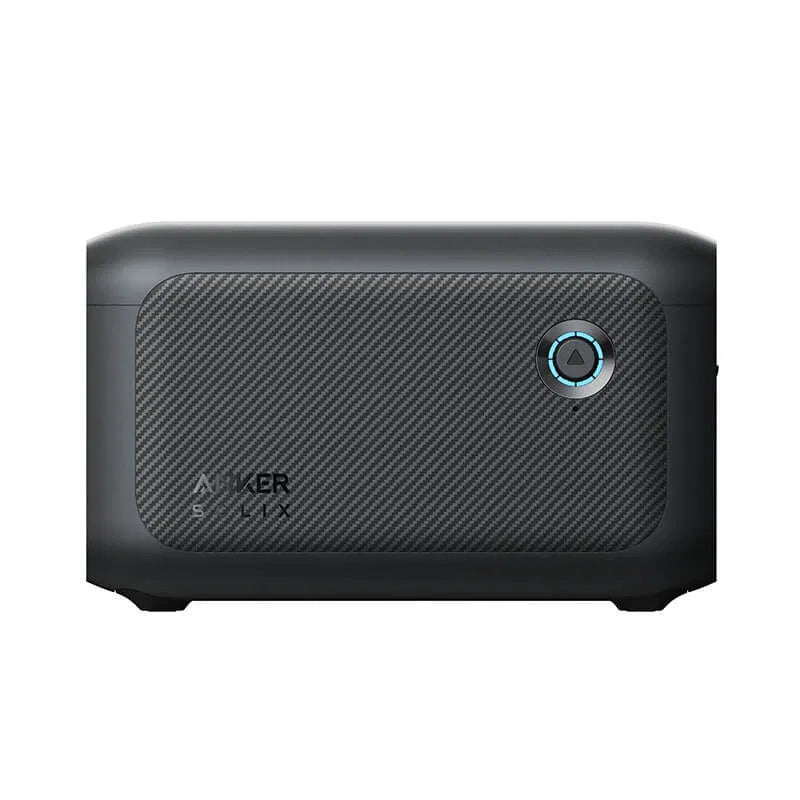 Anker Solix C1000 1056Wh expansion battery with dark gray carbon fiber textured front panel, power button with blue LED indicator, and rounded rectangular design shown from front angle view