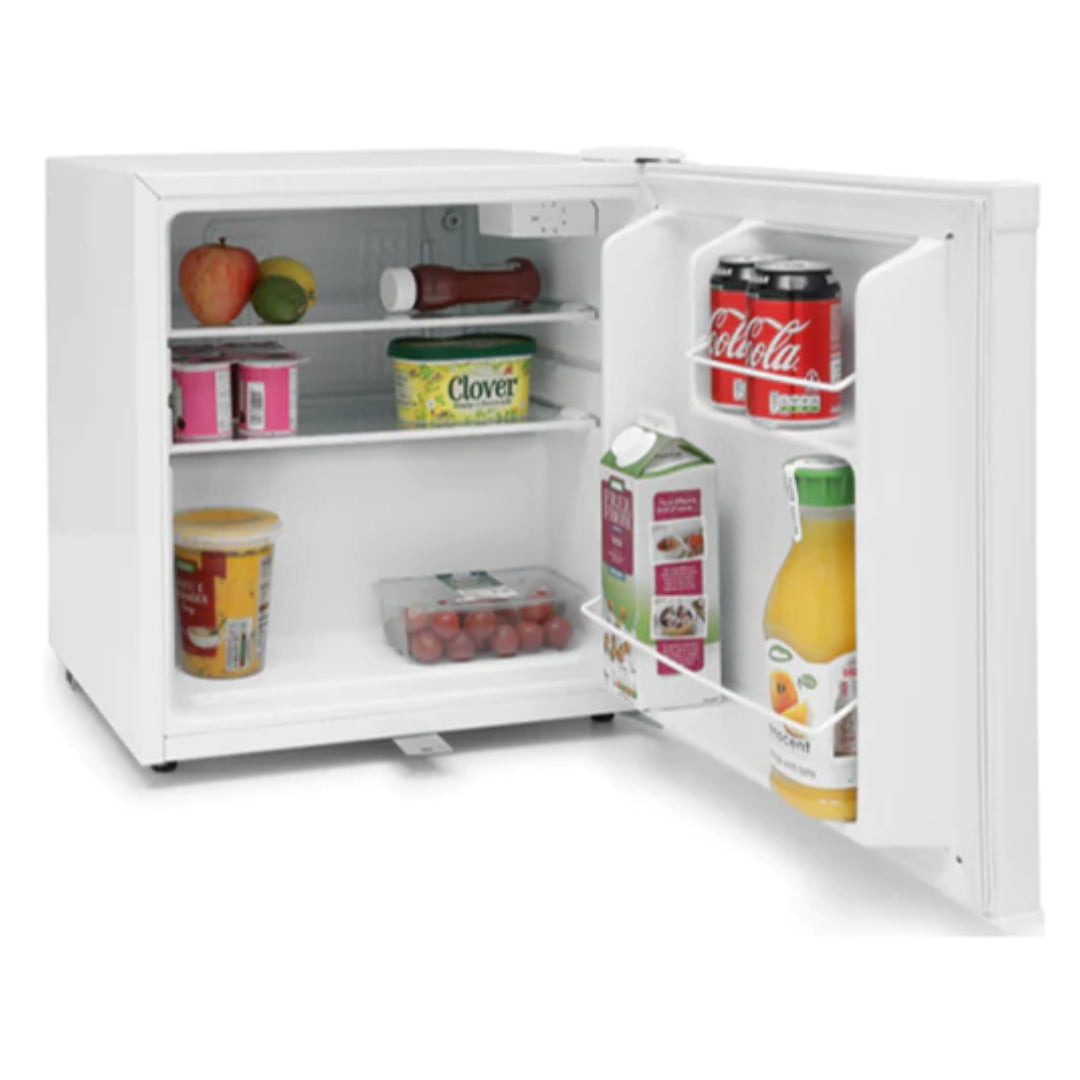 White compact counter-top larder fridge with open door displaying shelves stocked with fresh produce, beverages and groceries including Coca-Cola, orange juice, fruit and dairy products