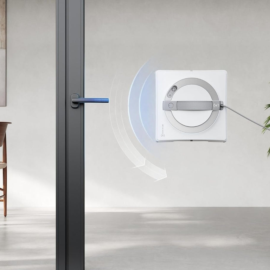 Modern interior design with a glass door and wall-mounted device.