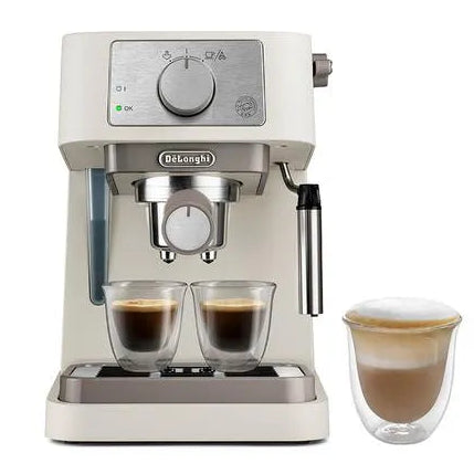 DeLonghi Stilosa cream espresso machine with dual shot glasses and milk frother, featuring stainless steel portafilter and control dial