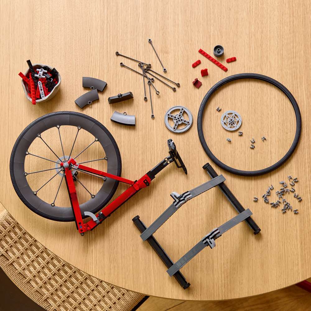 LEGO Icons Road Bike 11380 - a child building the set. 1015 pieces. Ages 18+.