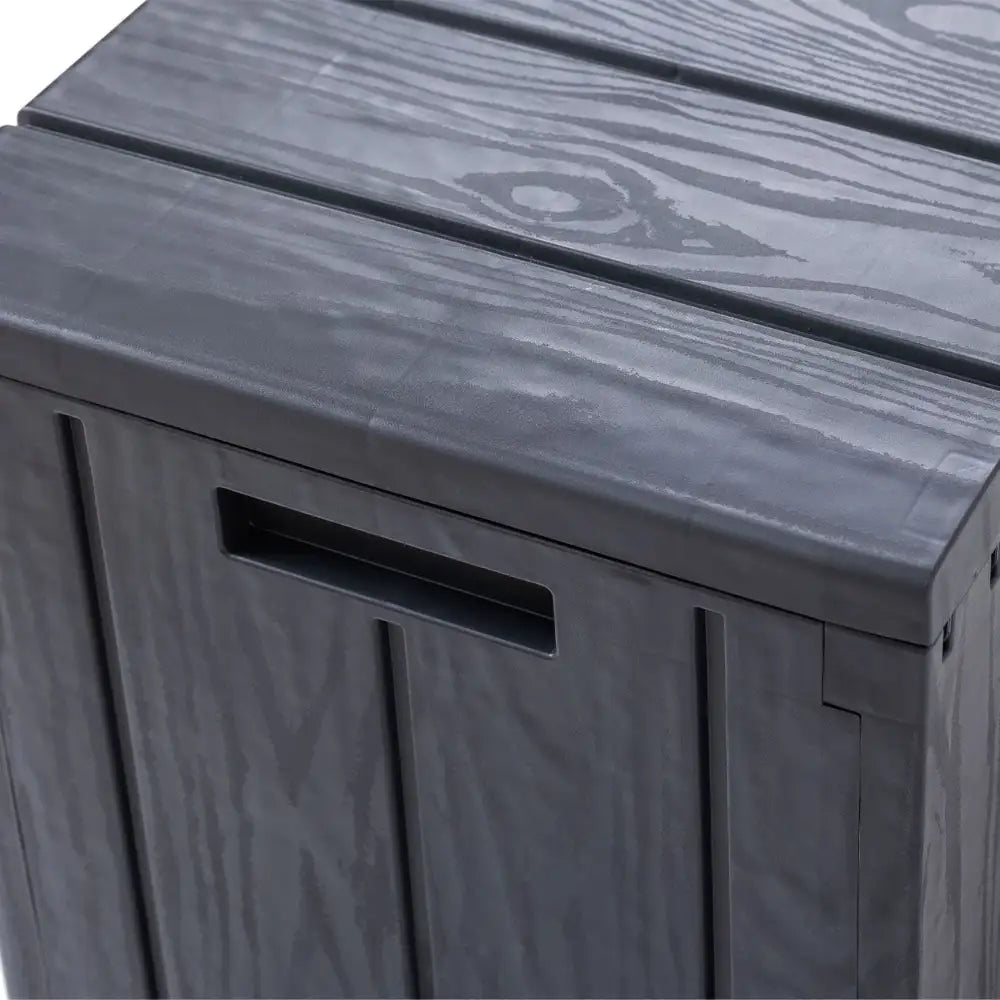 Toomax Bravo anthracite grey garden storage box with wood grain texture finish and lid open showing interior compartment