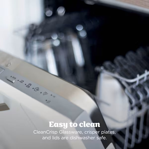 Open dishwasher displaying Ninja CRISPi PRO XL glass air fryer with black and white design, showing removable glass bowl and accessories with text overlay stating Easy to clean CleanCrisp Glassware, crisper plates, and lids are dishwasher safe