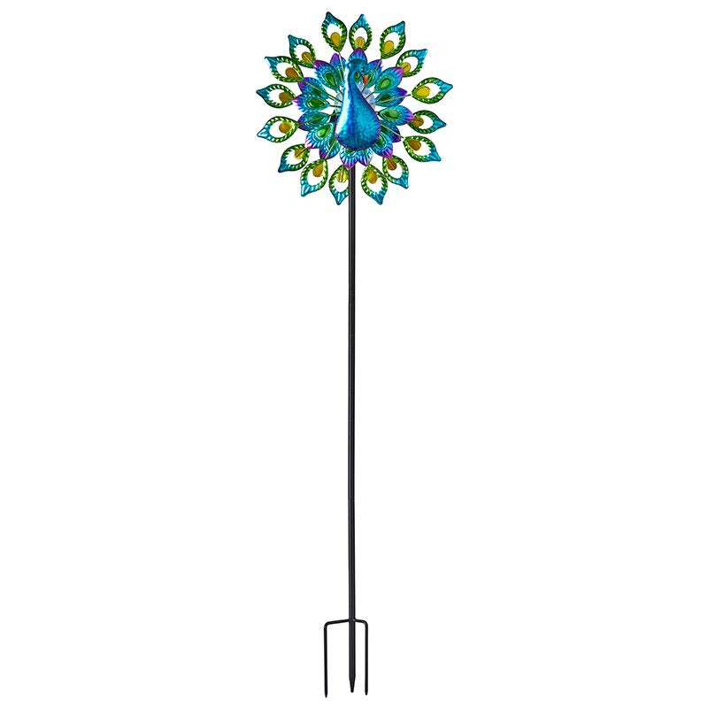 Decorative peacock solar wind spinner with vibrant blue and green feathered design, yellow accents, long black metal stake pole for garden display