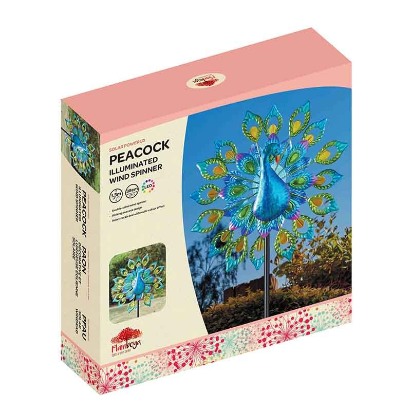 Solar powered peacock illuminated wind spinner with blue body and multicolored tail feathers displayed in retail packaging with product images and pink branded box top