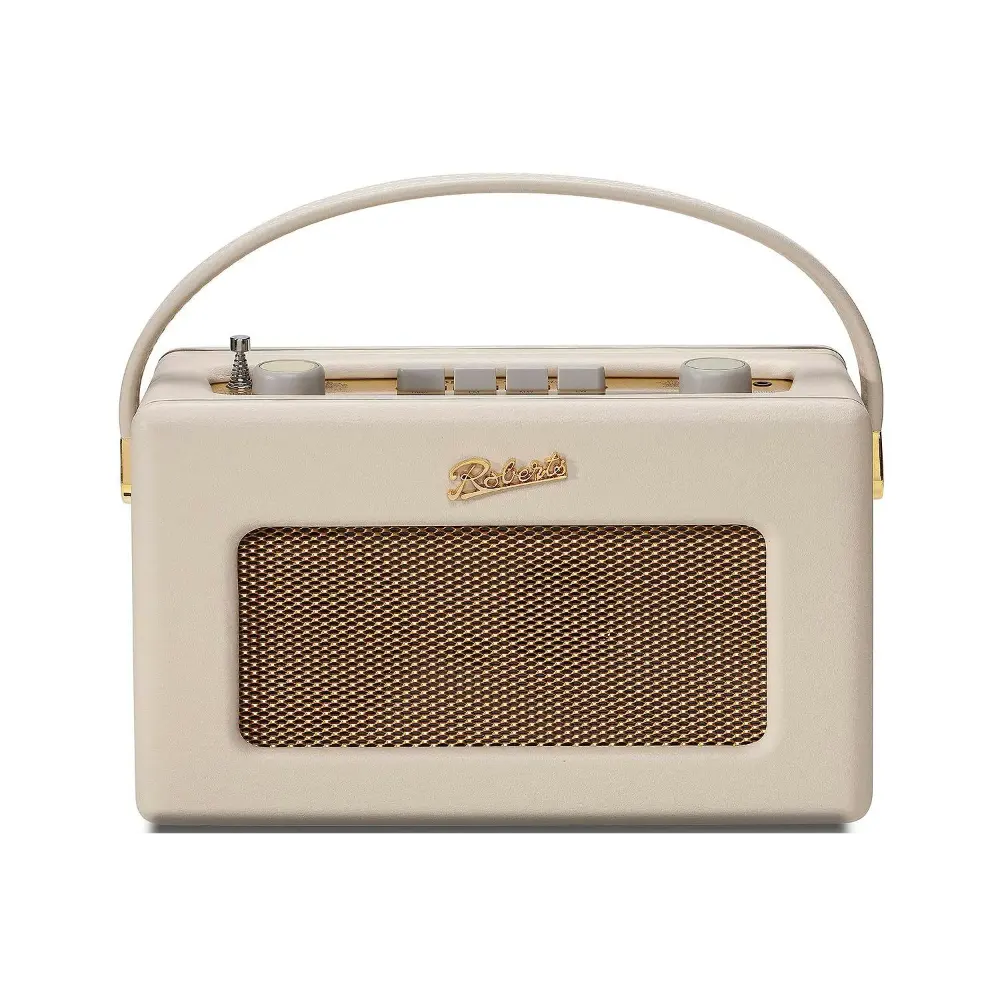 Roberts Revival FM/DAB portable radio in cream with gold accents, featuring a carrying handle, mesh speaker grille, and control buttons on top