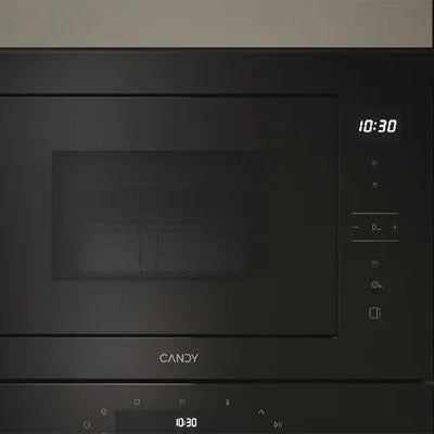 Candy 20 litre built-in microwave with grill in stainless steel and black finish, displaying digital time display at 10:30 with control buttons on right side