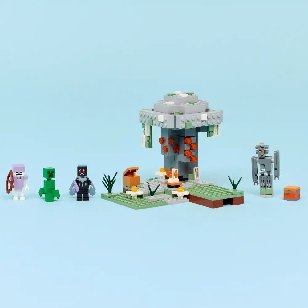 LEGO Minecraft The Pale Garden set 21586 featuring a pale wood structure with hanging orange pumpkins, minifigures including a pink axolotl and creeper mob, green grass baseplate, vegetation elements, and accessories on light blue background