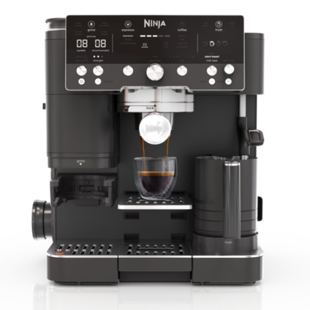 Ninja coffee maker dispensing coffee into a glass cup on a white background