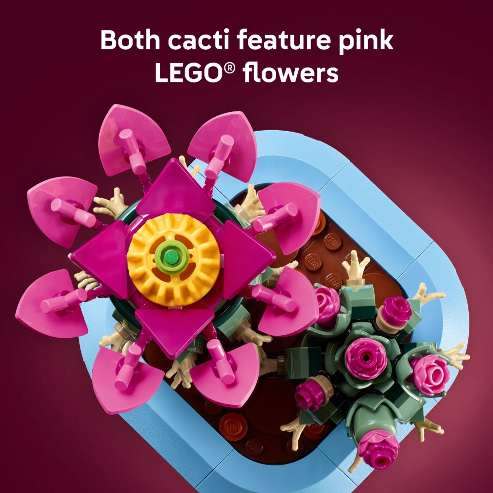 LEGO Flowering Cactus set 11509 featuring two potted cacti with bright pink flowers, yellow centers, and green stems displayed in blue ceramic pots against a burgundy background