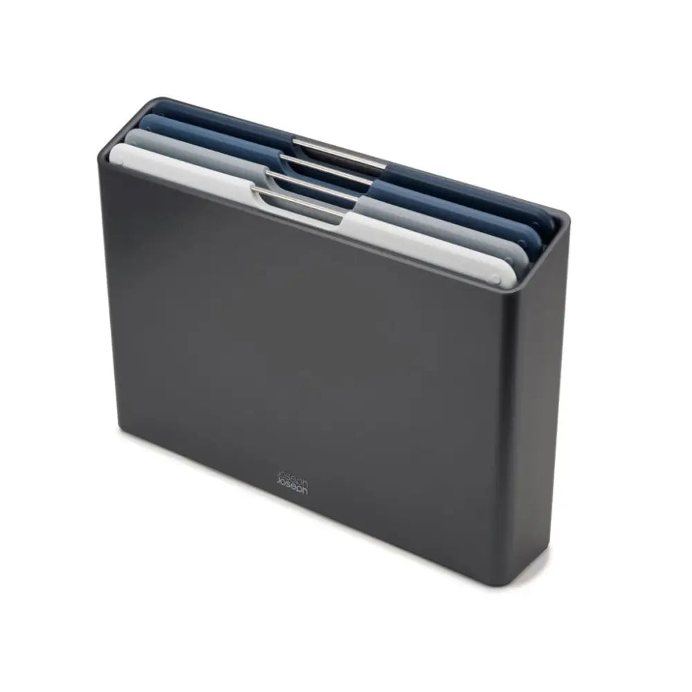 Joseph Joseph Folio 4 Piece Chopping Board Set in graphite grey with navy blue, white and grey boards stacked in black storage case