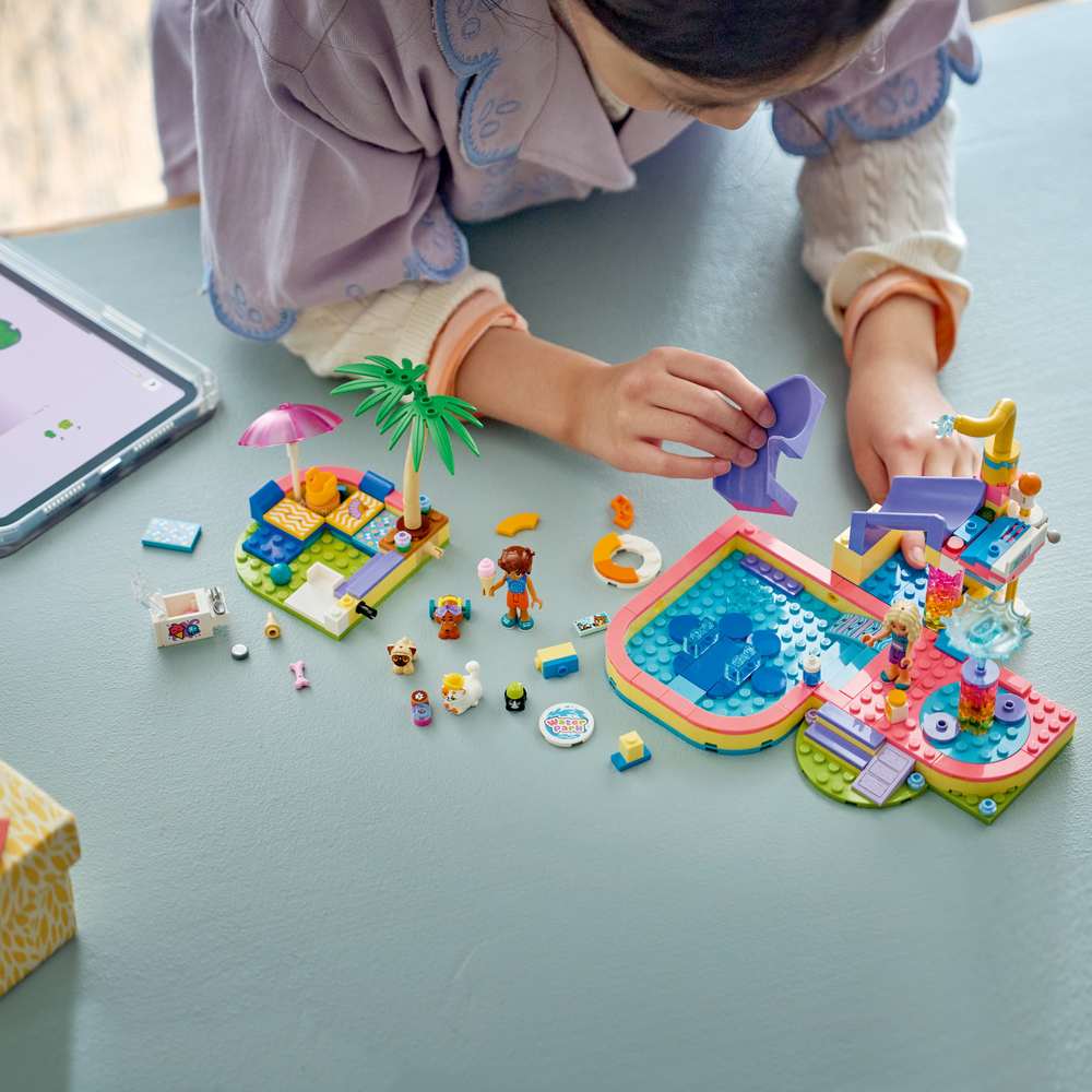 LEGO Friends Fun Water Park Day 42676 - a child building the set. 278 pieces. Ages 6+.