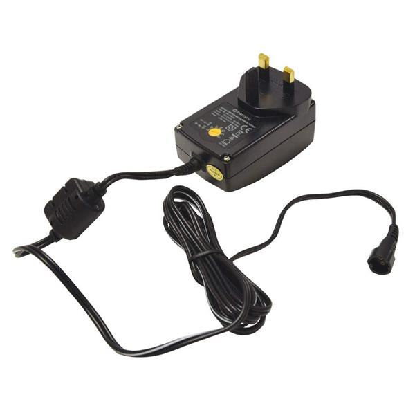 Black switch-mode variable voltage power supply adapter 1500mA with UK plug head, power cord and connector cable on white background