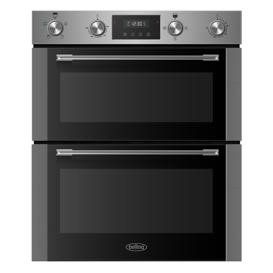 Belling stainless steel built under electric double oven with dual cooking chambers, four control knobs, digital display showing 12:30, and chrome handles against dark grey cabinetry