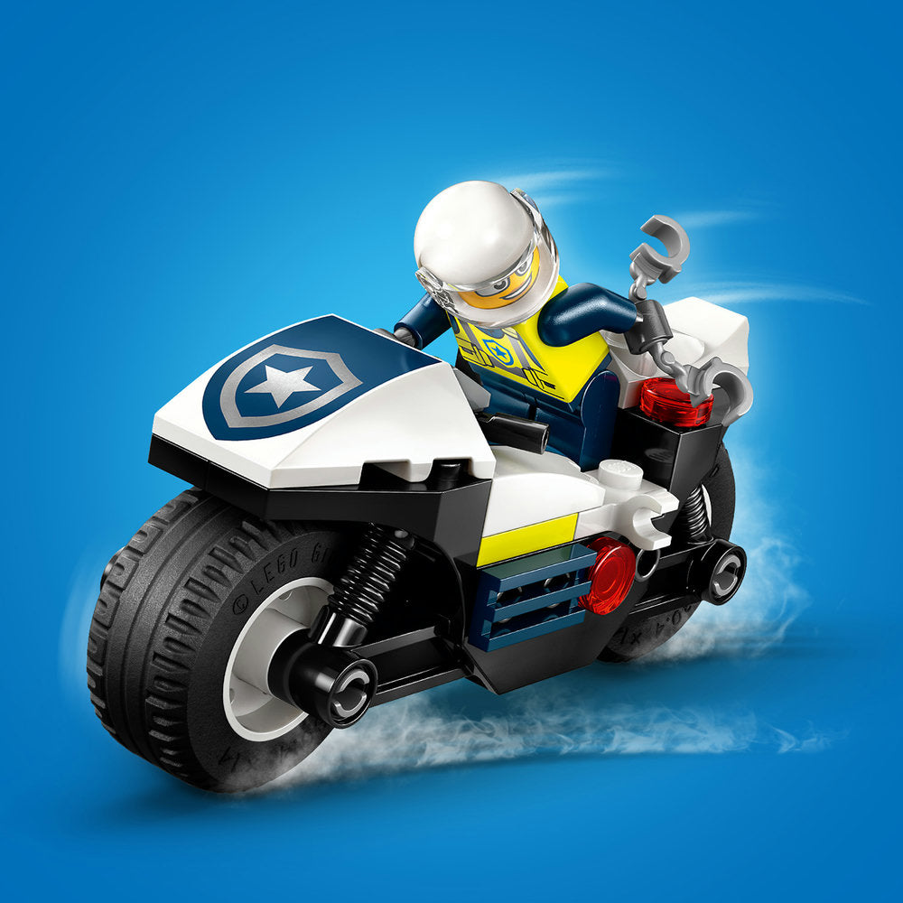 LEGO police motorcycle set 60455 featuring a minifigure officer in yellow and blue uniform on a white, black and yellow police bike with star badge emblem against blue background
