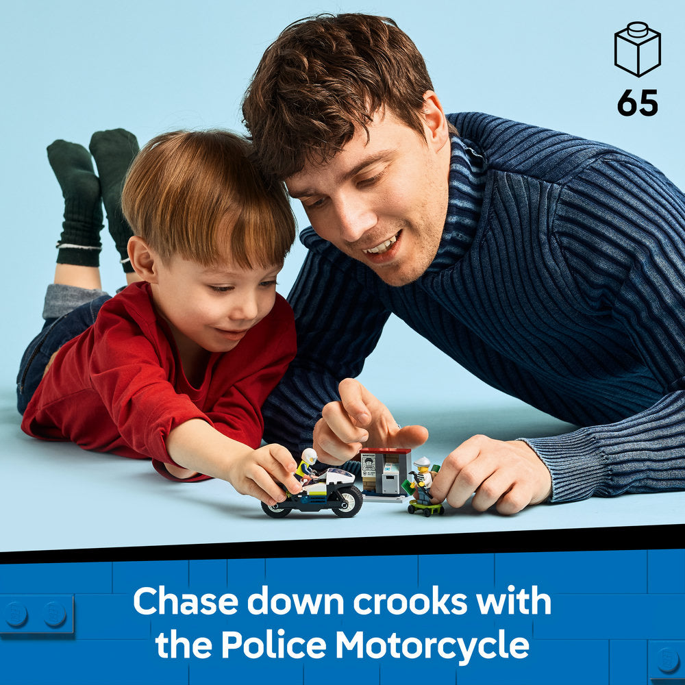 Adult and child playing with LEGO Police Motorcycle Chase set 60455 on blue surface, featuring black police motorcycle and green criminal figure, with 65 pieces indicated in top right corner