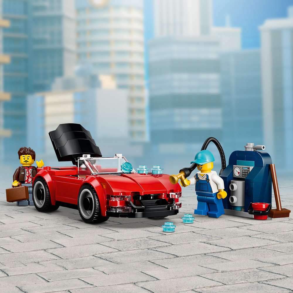 LEGO City Drive-Through Car Wash 60497 red convertible from the set on a city street with driver minifigures
