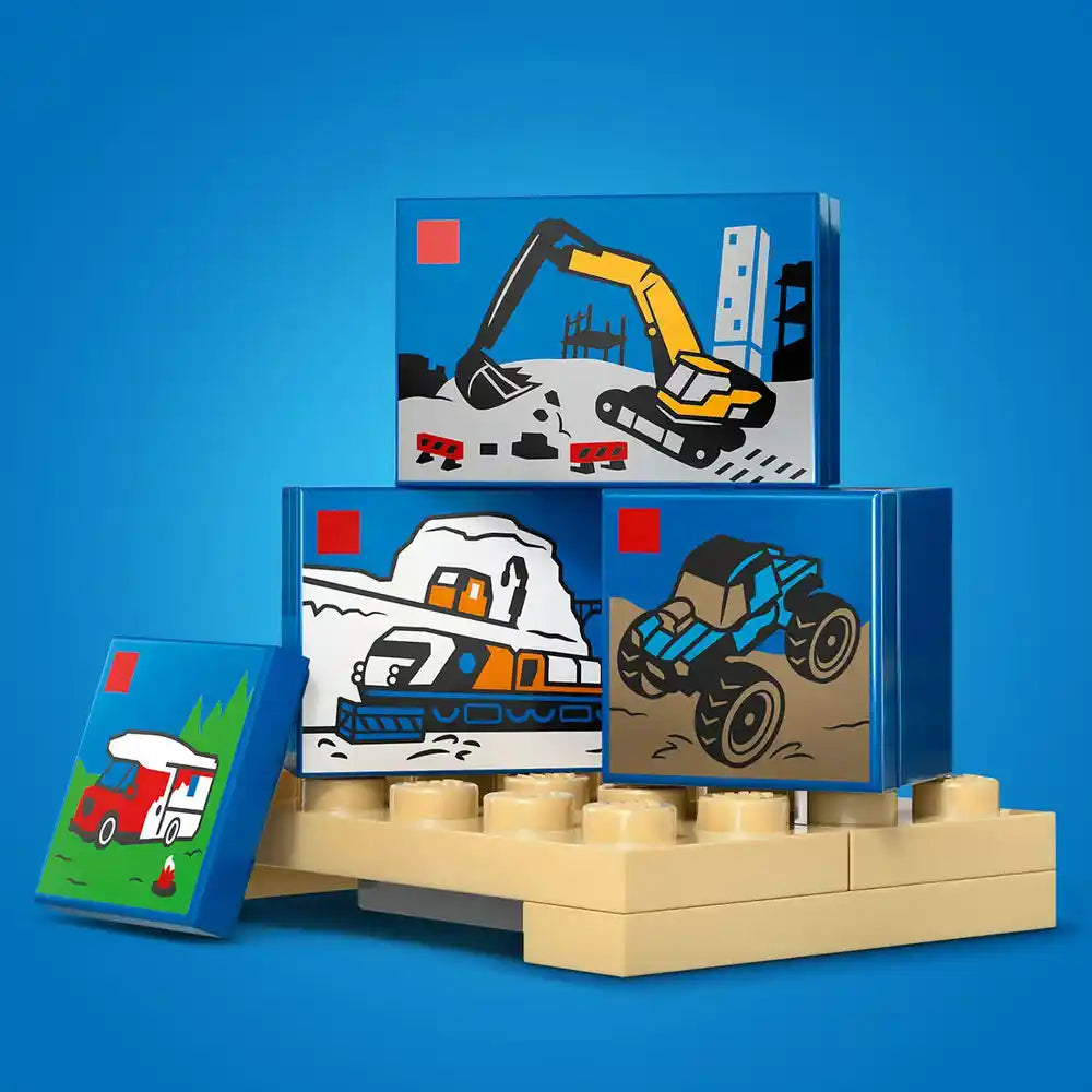 LEGO construction-themed storage boxes stacked on tan LEGO base plates against blue background, featuring illustrated excavator, snow plow truck, and tractor vehicles on blue box sides, with small green fire truck illustration on separate blue box to the left