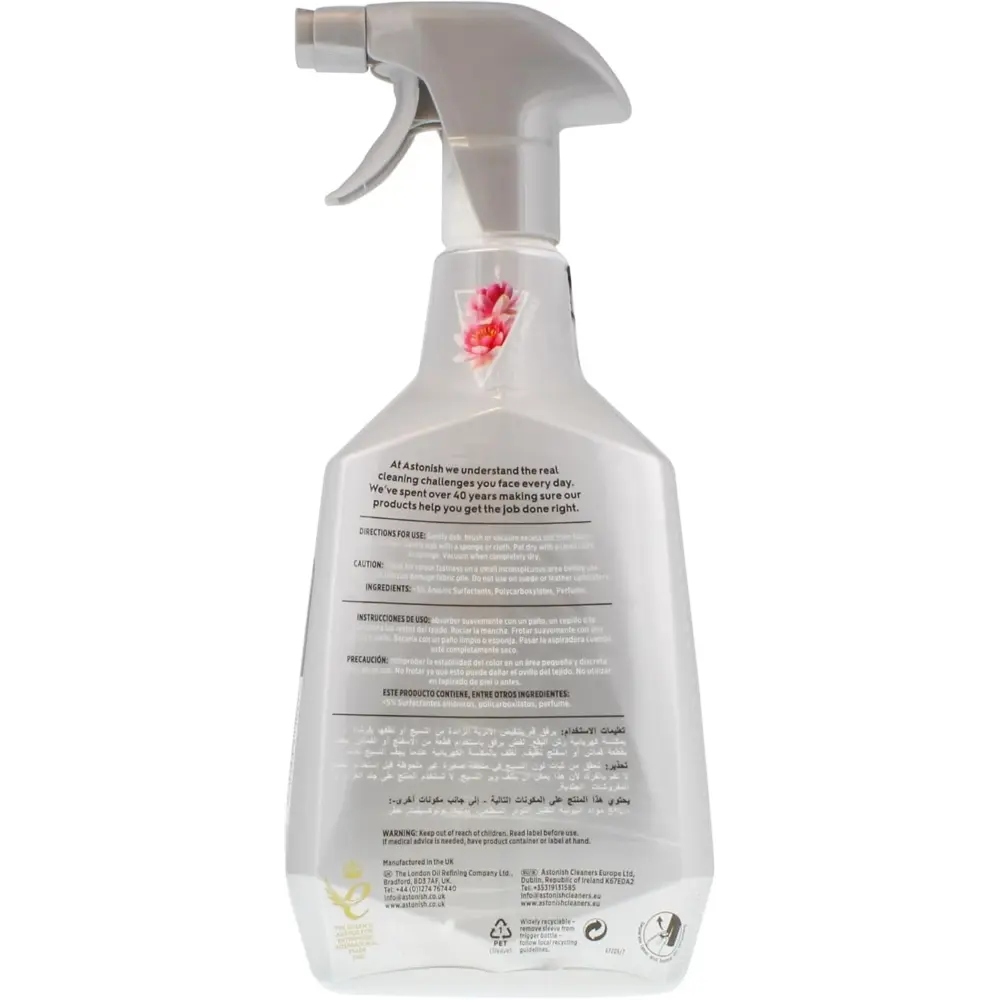 Astonish Premium Carpet and Upholstery Cleaner 750ml spray bottle with trigger dispenser, clear plastic container featuring pink floral design and multilingual product information label on white background