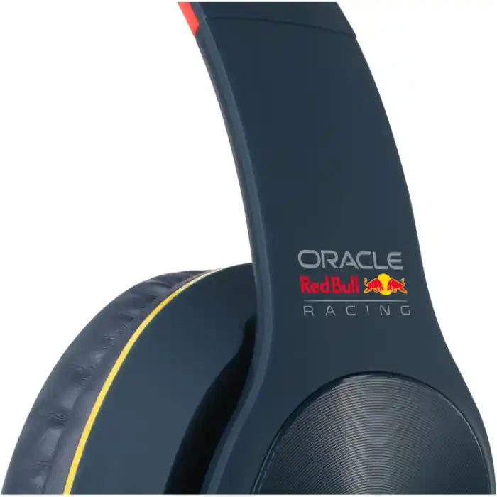 Oracle Red Bull Racing over-ear Bluetooth headphones in navy blue with yellow accent stripe and red bull logo detail on ear cup