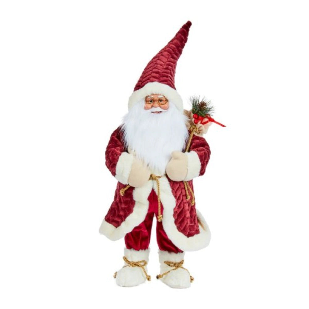 Burgundy and cream decorative Papa Noel Santa figurine 60cm tall wearing a quilted pointed hat, long coat with white fur trim, white mittens and boots with gold rope ties, holding a festive greenery bunch with red ribbon