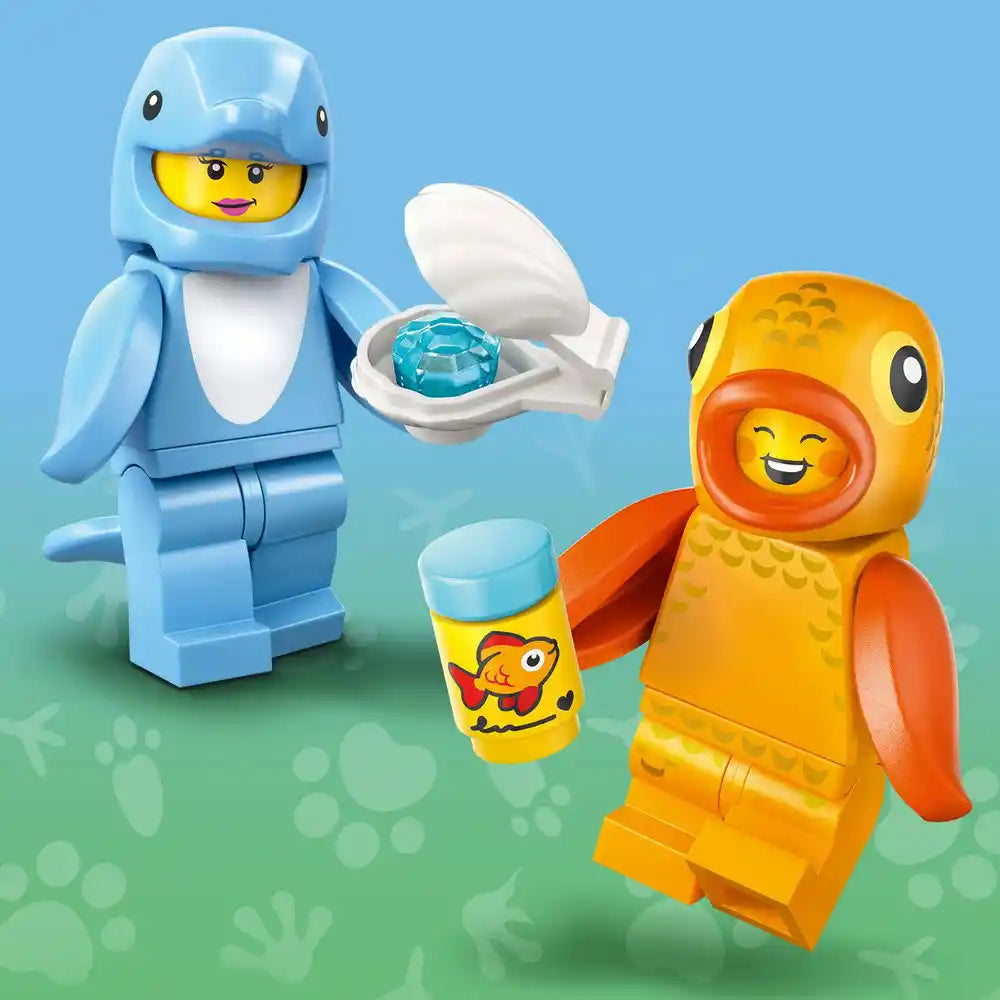 LEGO minifigure animals from Series 28 featuring a blue dolphin character holding a gem in a shell, a yellow and orange parrot character, and a yellow fish accessory on a blue-green gradient background