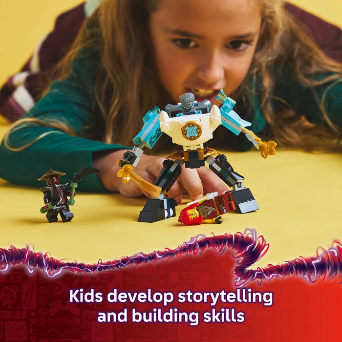 Child playing with blue, white, and gold LEGO Zane's Battle Suit Mech buildable robot toy on yellow background with smaller robot figures, demonstrating storytelling and building skills