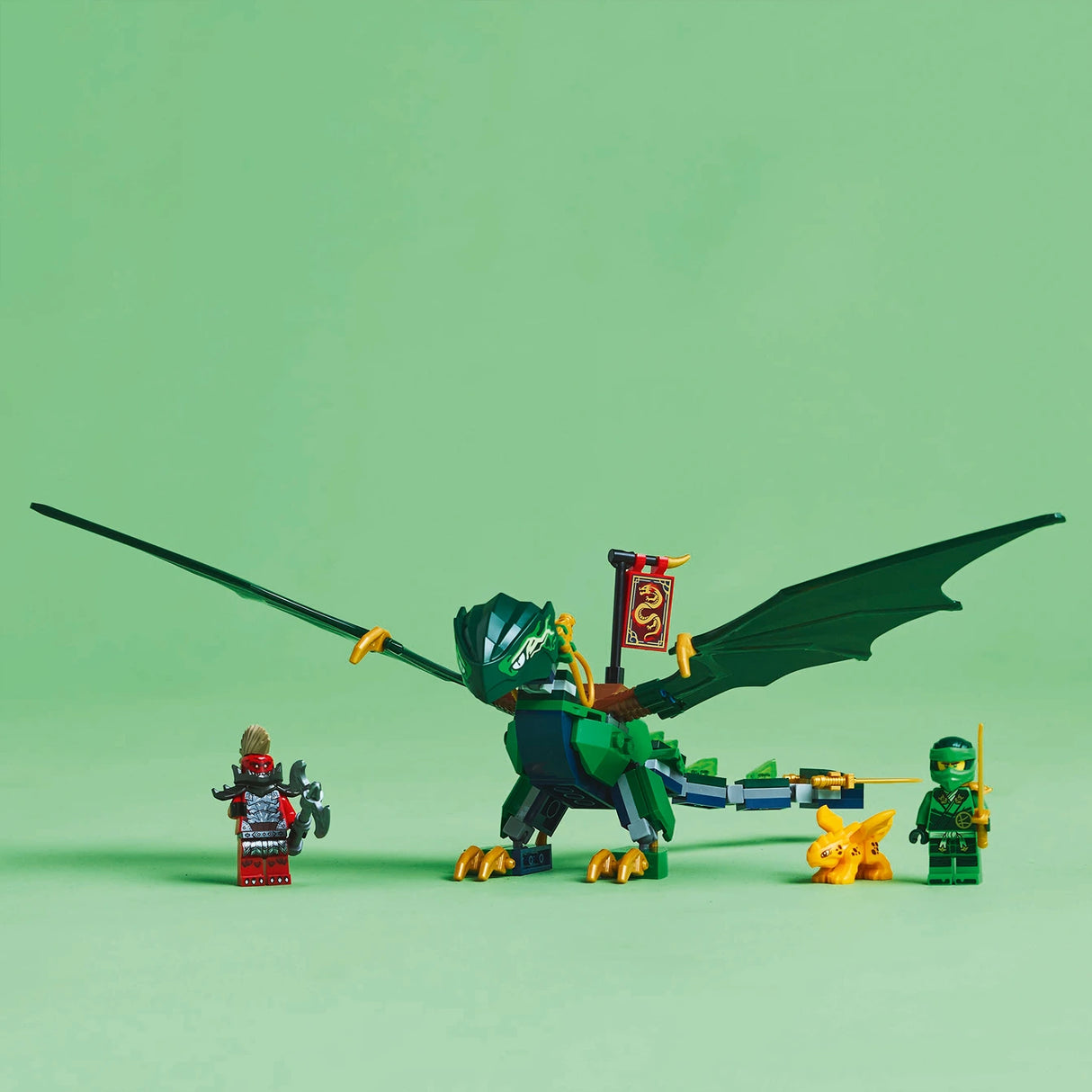 LEGO Lloyd's Green Forest Dragon set 71829 featuring a large green dragon with extended wings, gold claws and accents, alongside three minifigures including Lloyd in green ninja outfit and a small yellow dragon companion on mint green background
