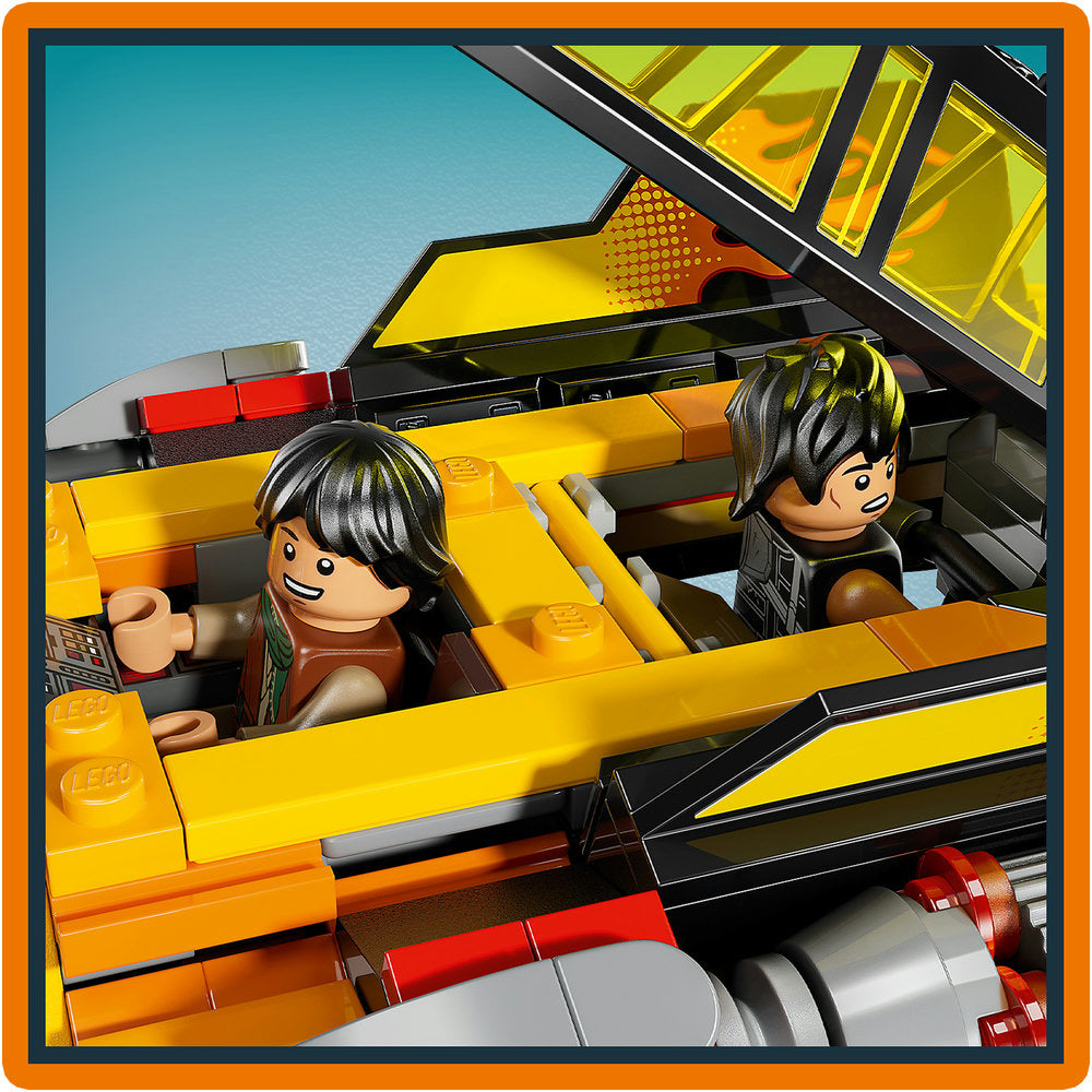 LEGO minifigures with black hair seated in a bright yellow and orange brick-built vehicle with black accents, featuring an open cockpit design and red and silver engine components visible below, set against a clear blue sky background