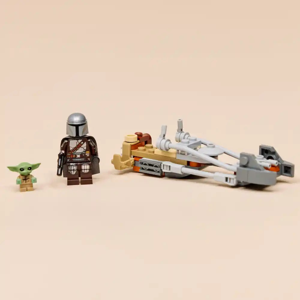 LEGO Star Wars minifigures and speeder bike set including The Mandalorian character in brown armor, green Grogu figure, tan and orange starfighter vehicle with white engines, and gray ship components against beige background