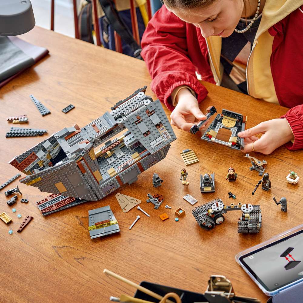 LEGO Star Wars™ Offworld Sandcrawler™ and Mudhorn 75453 - a child building the set. 1683 pieces. Ages 14+.