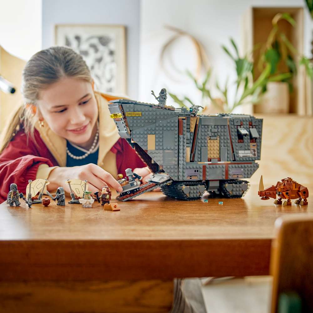 LEGO Star Wars™ Offworld Sandcrawler™ and Mudhorn 75453 - a child playing with the finished build. 1683 pieces. Ages 14+.