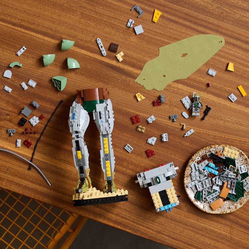 LEGO Star Wars™ Boba Fett™ 75455 - a child building the set. 1544 pieces. Ages 18+.