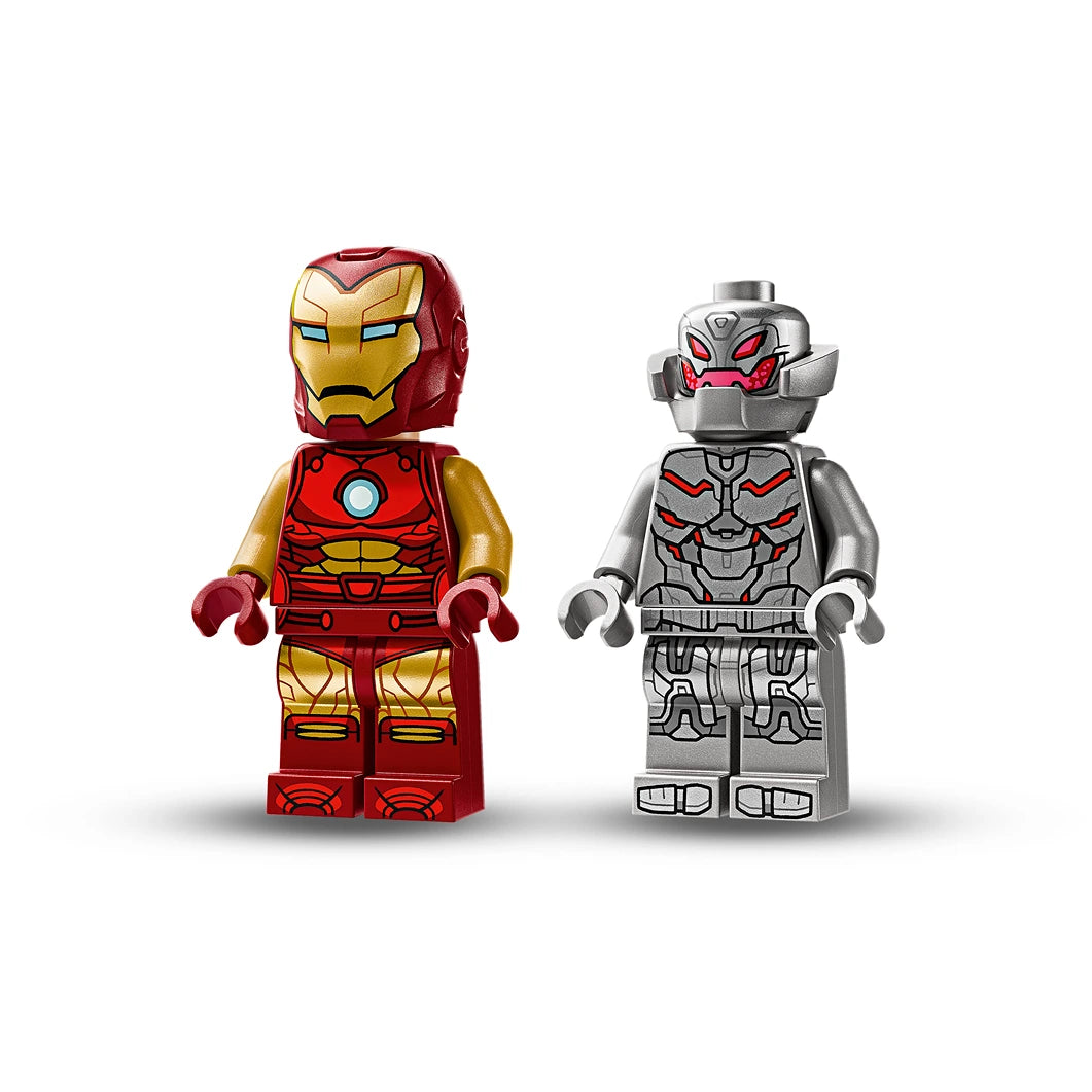 LEGO minifigures of Iron Man in red and gold armor with blue arc reactor facing silver and red Ultron robot with glowing red eyes, from set 76307