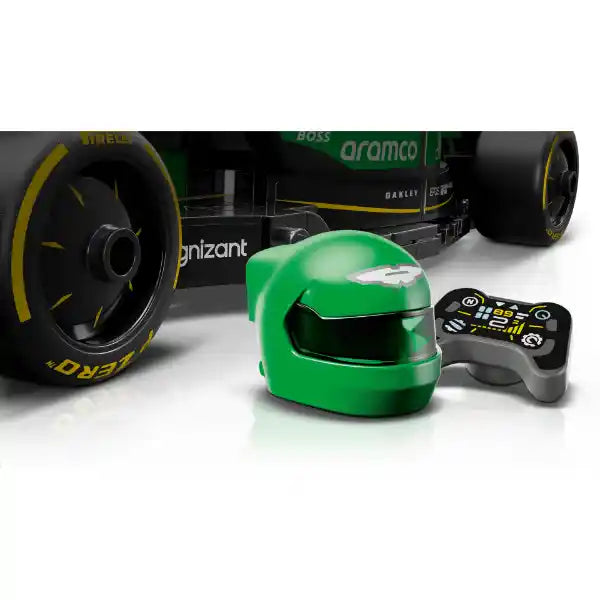 LEGO Aston Martin F1 AMR24 race car set featuring green helmet, black remote control, and detailed dark green and black Formula 1 vehicle model with yellow Dunlop tires