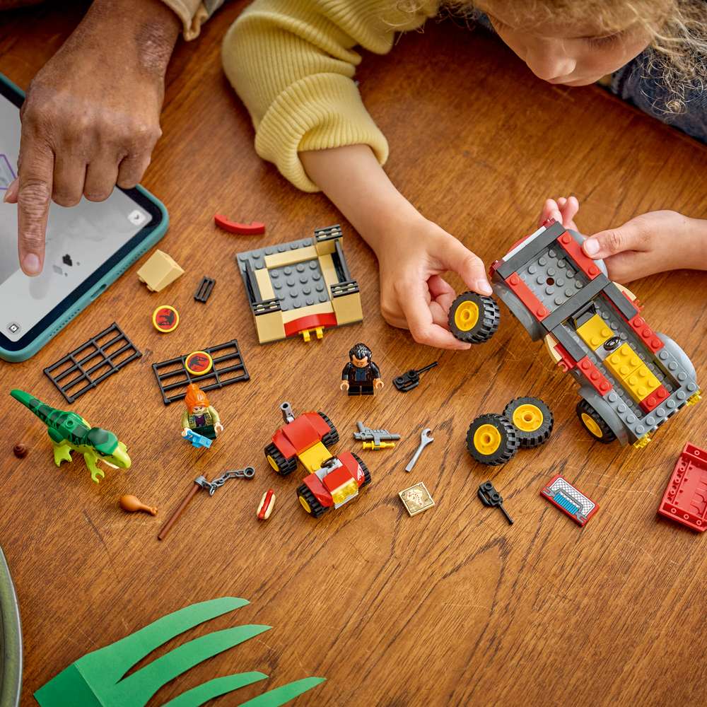 LEGO Jurassic World Young T. rex Transport Truck 77978 - a child building the set. 115 pieces. Ages 4+.