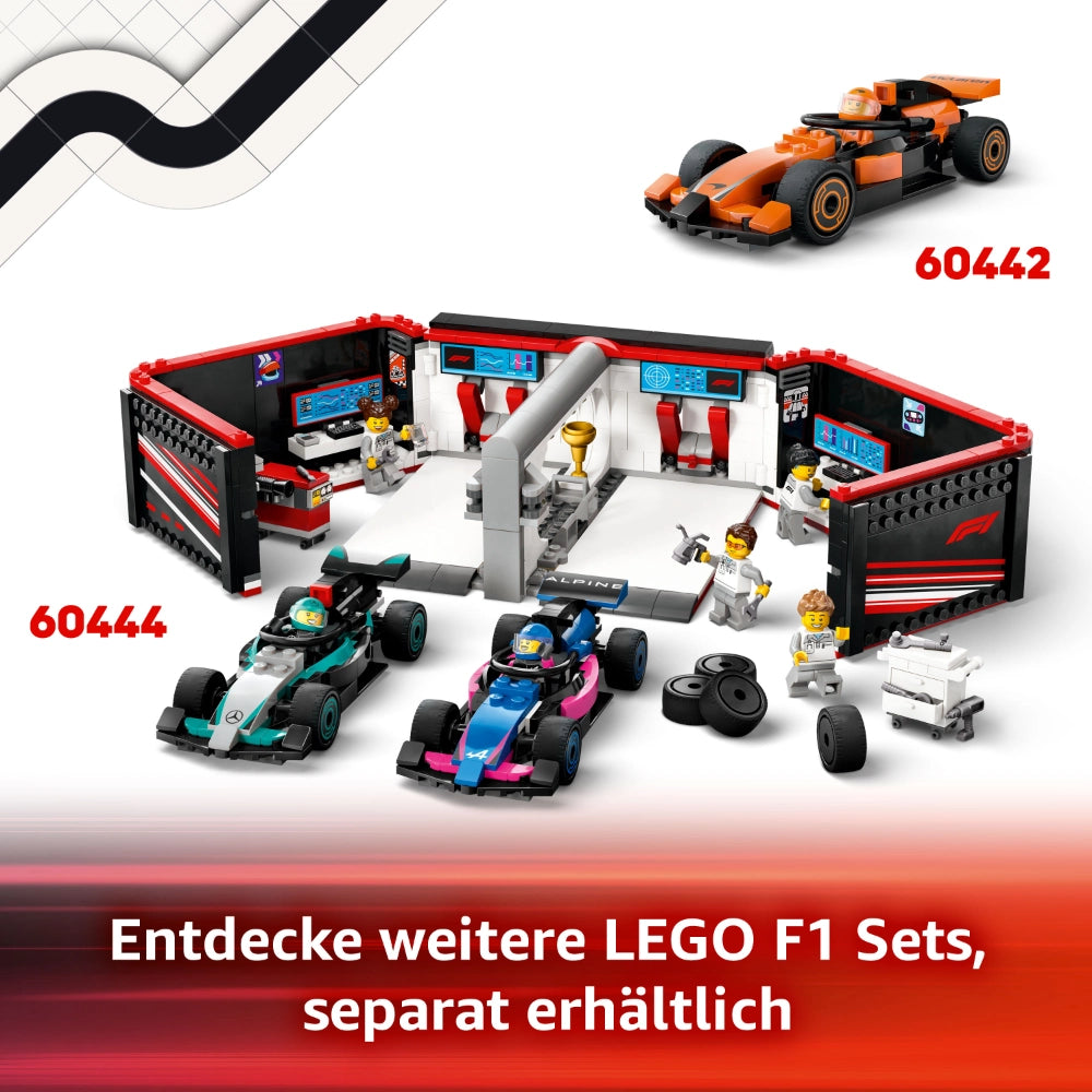 LEGO F1 set 60442 featuring orange McLaren race car, pit garage with red and black details, two turquoise and pink Formula 1 cars, minifigures, trophy, tires and pit crew accessories displayed against white background
