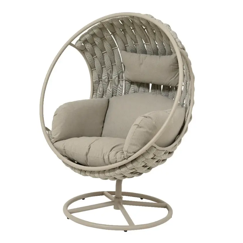 Kaemingk Serenity Swivel Egg Chair in beige woven rattan with cushioned grey upholstered seat and back pillow on metal stand base