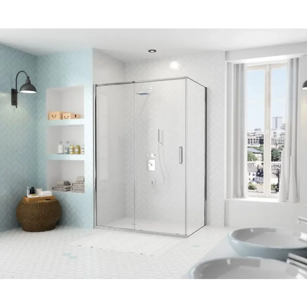 Modern bathroom featuring Merlyn ARYSTO Eight sliding shower door with chrome frame and clear glass panels, light blue tile accent wall with white built-in shelving, white hexagonal floor tiles, dual white vessel sinks, large windows with city view, and contemporary fixtures