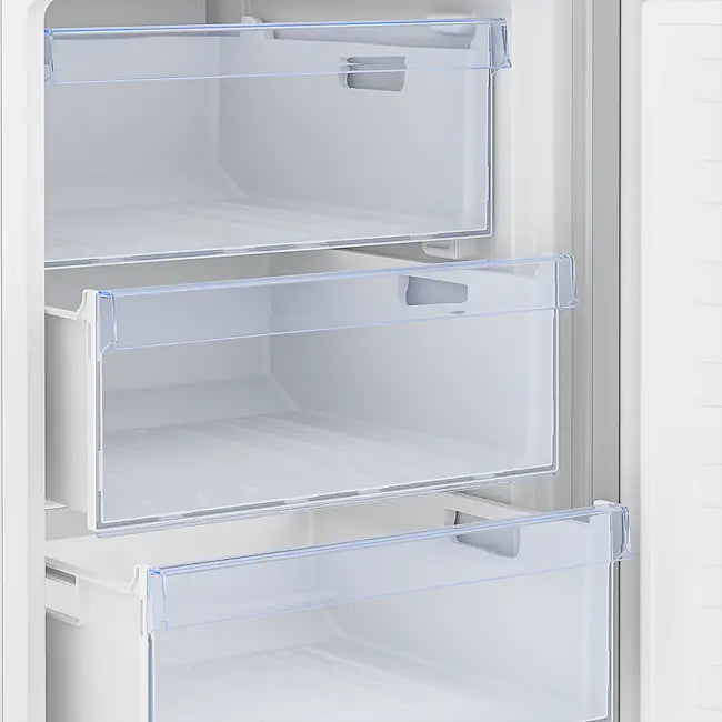 Beko CSG4582S combi fridge freezer with open transparent drawers showing white interior compartments and silver exterior finish