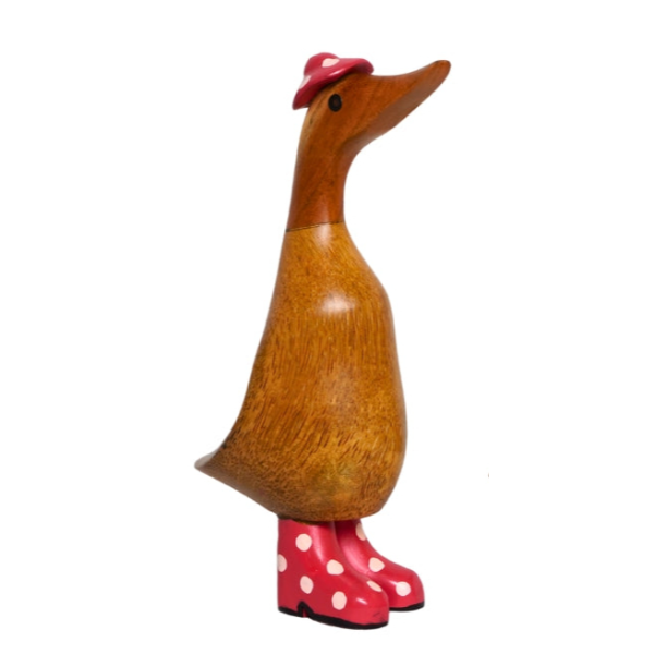 Wooden duck figurine with natural brown wood body, long carved neck, red and white polka dot wellie boots, and matching red hat with white spot, 22cm tall