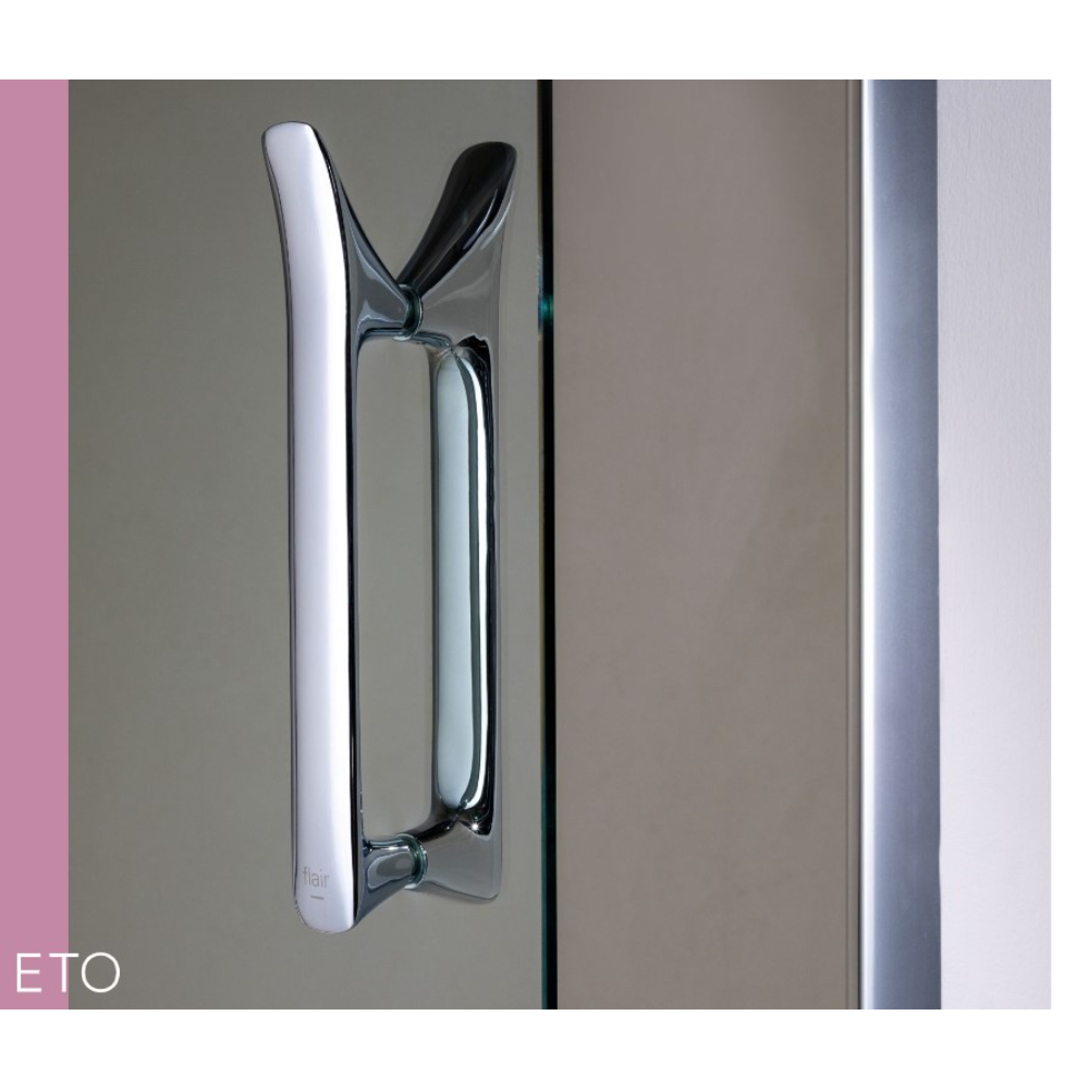 Close-up of chrome and black Flair ETO sliding shower door handle mounted on glass panel, showing modern minimalist design with polished metal finish and dual-tone color scheme