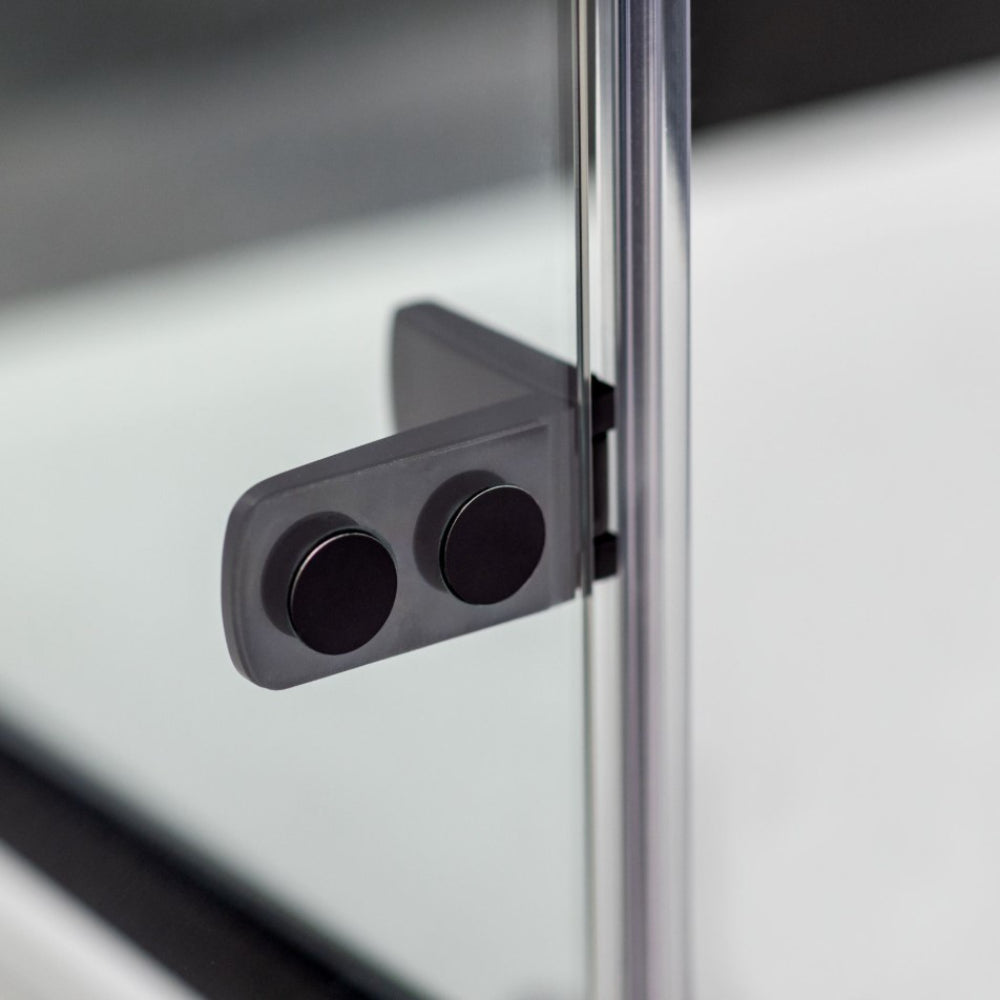 Flair ETO chrome and matte black pivot hinge for frameless shower door, showing dual circular hinges mounted on glass panel with metal frame detail