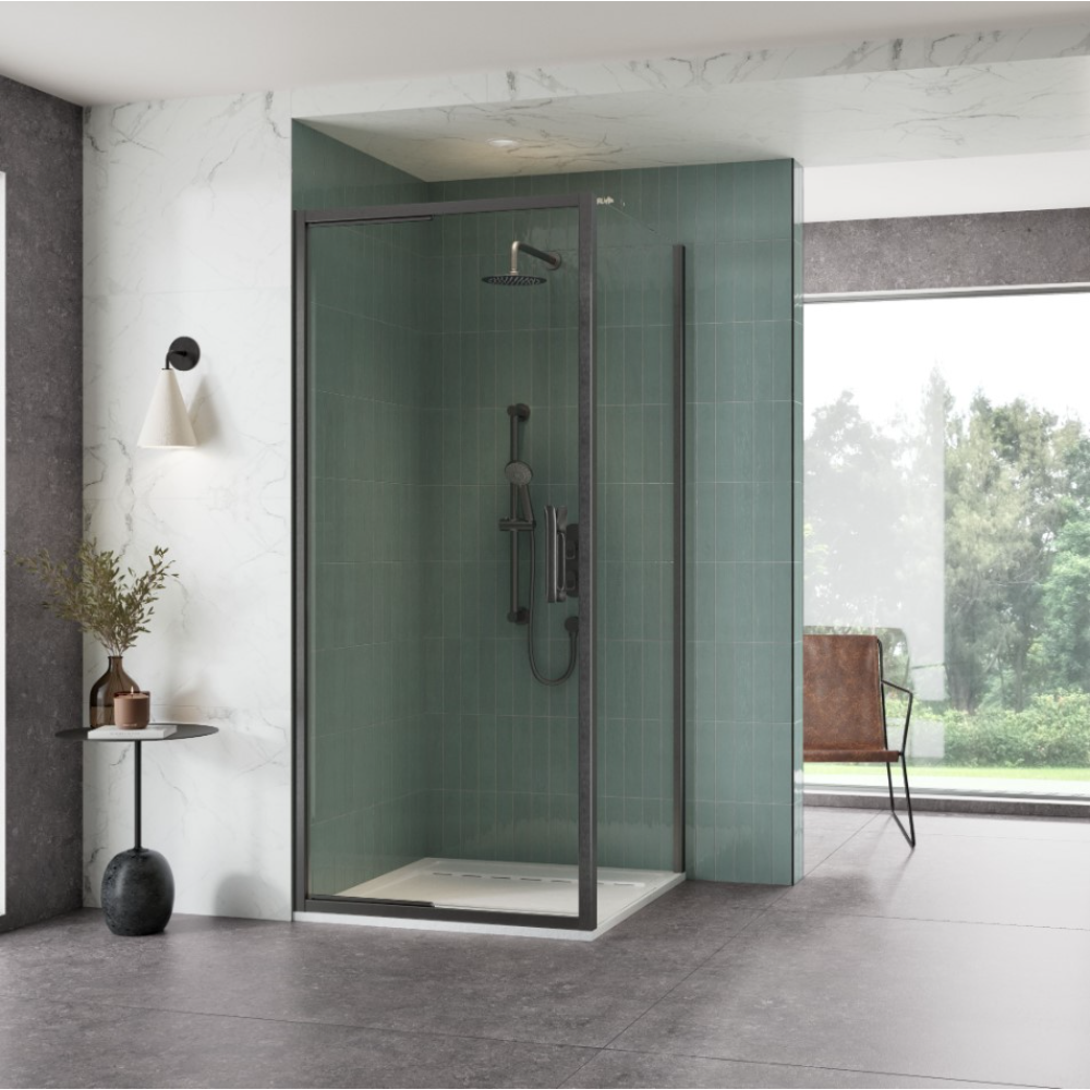 Modern bathroom featuring a Flair ETO Infold shower door with gunmetal frame and green subway tile walls, chrome rainfall showerhead and hand shower, cream tile flooring, marble accent wall, minimalist décor with small side table and potted plant, large window overlooking garden