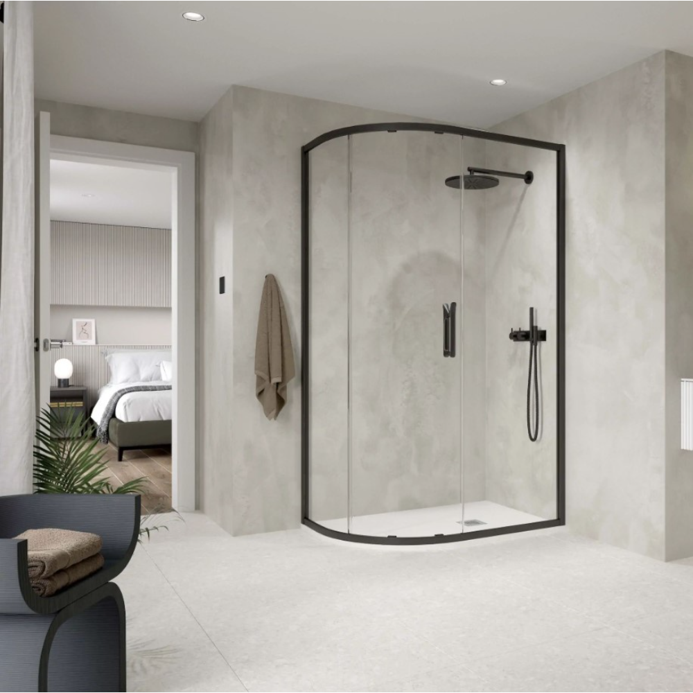 Modern bathroom featuring a matte black framed quadrant shower enclosure with curved glass doors, rainfall showerhead and handheld spray, set against light grey textured tile walls with white floor tiles, adjoining an en-suite bedroom visible through open doorway