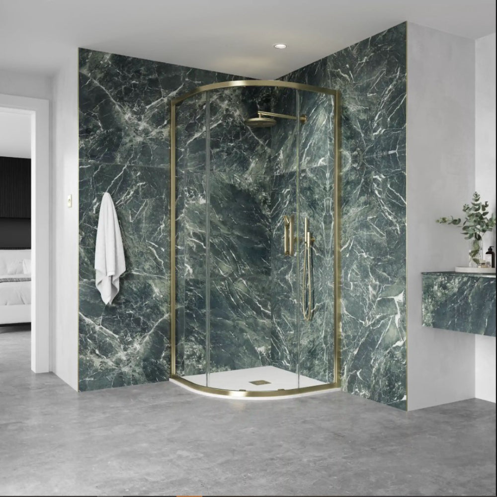 Flair ETO quadrant shower enclosure with brushed brass frame and green marble effect wall panels in modern bathroom setting