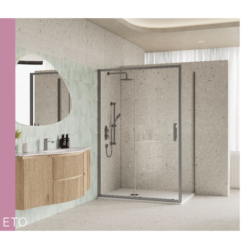 Modern bathroom with Flair ETO sliding shower enclosure featuring grey stone effect tiles, dark metal frame, and matching dark hardware alongside curved wooden vanity unit with round mirror and light green tile splashback