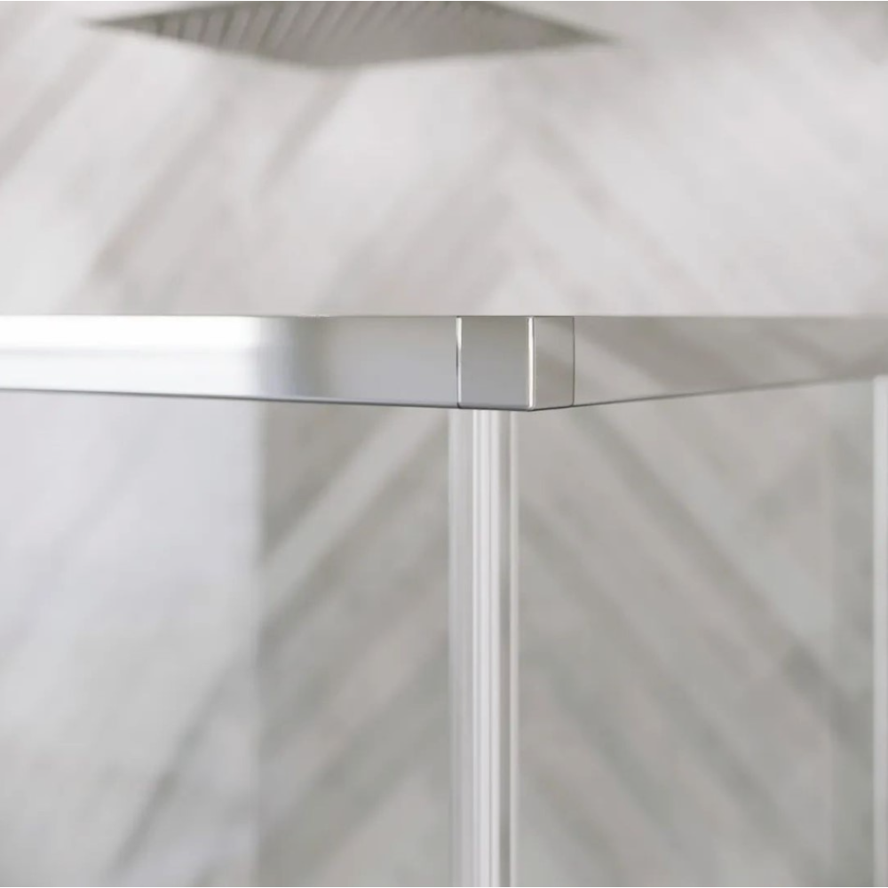 Close-up detail of chrome hinge mechanism on frameless glass shower door with white vertical profile and diagonal shadow pattern visible through clear glass panel