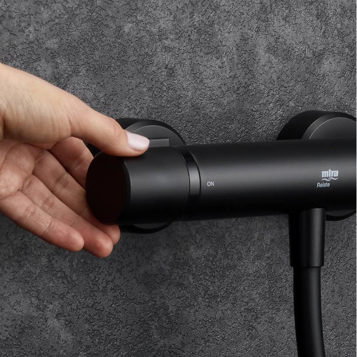 black shower head with hose and control on a white background