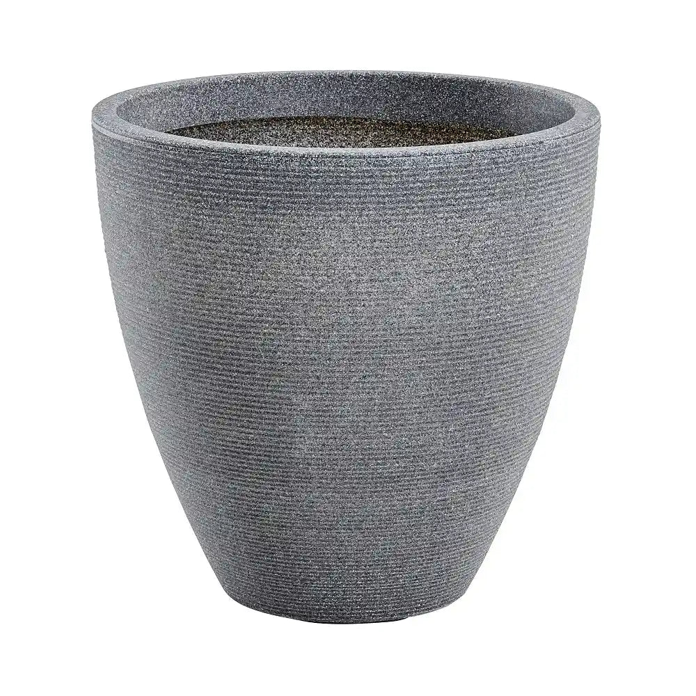 Large ash gray textured concrete garden planter pot with tapered cylindrical design and horizontal ribbed surface pattern